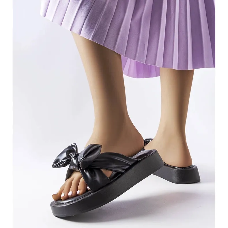 Black platform sandals with a bow from Edvard